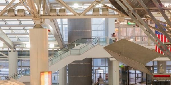 interior of airport that utilizes decorative wire mesh as a design element